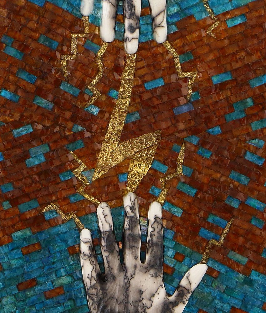 Photo of Caryn Mitchell’s, Connect, 12 x 24, mixed media glass mosaic artwork detail of amber and sea blue glass mosaic with gold and two life casted horse hair raku fired hands